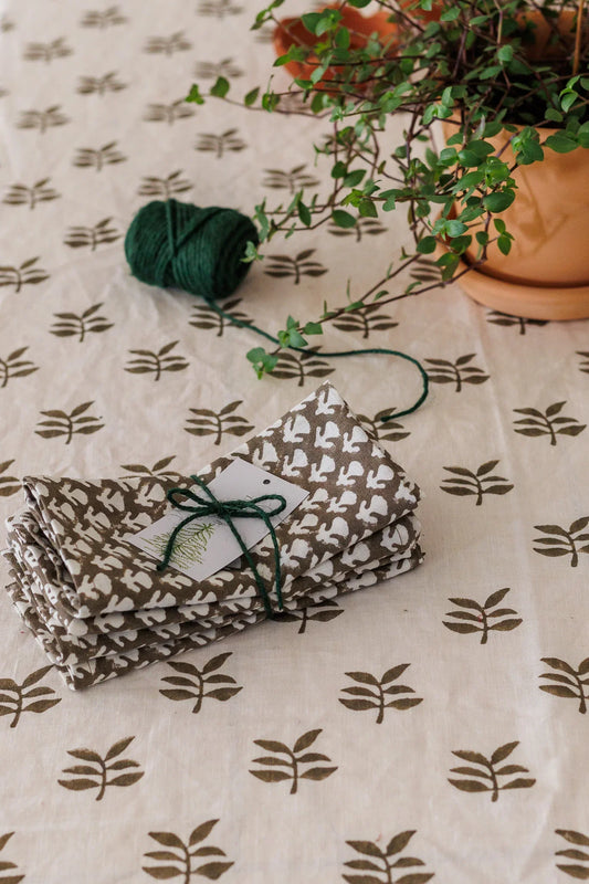 Folded fabric with a pattern on a tablecloth with leaf pattern
