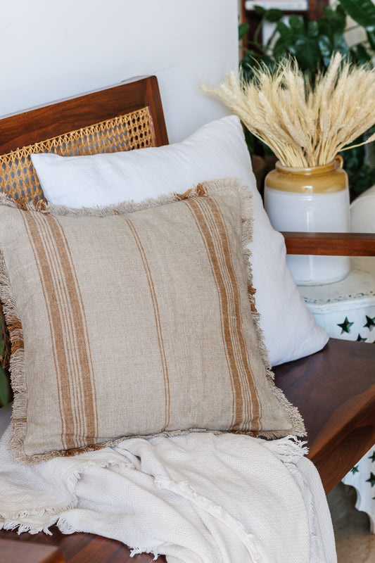 Beige and White Cushions on a Wooden bench