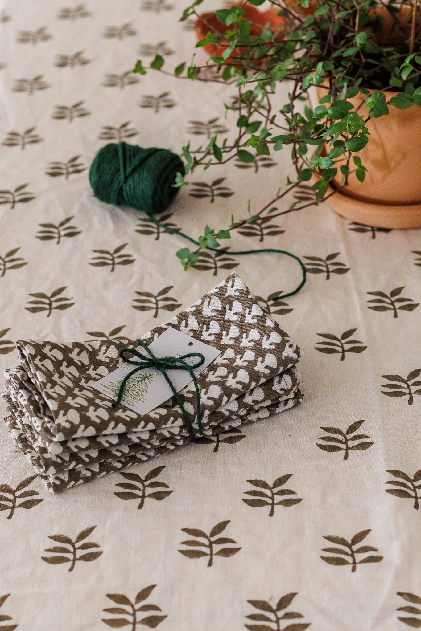 Folded fabric with a pattern on a tablecloth with leaf pattern