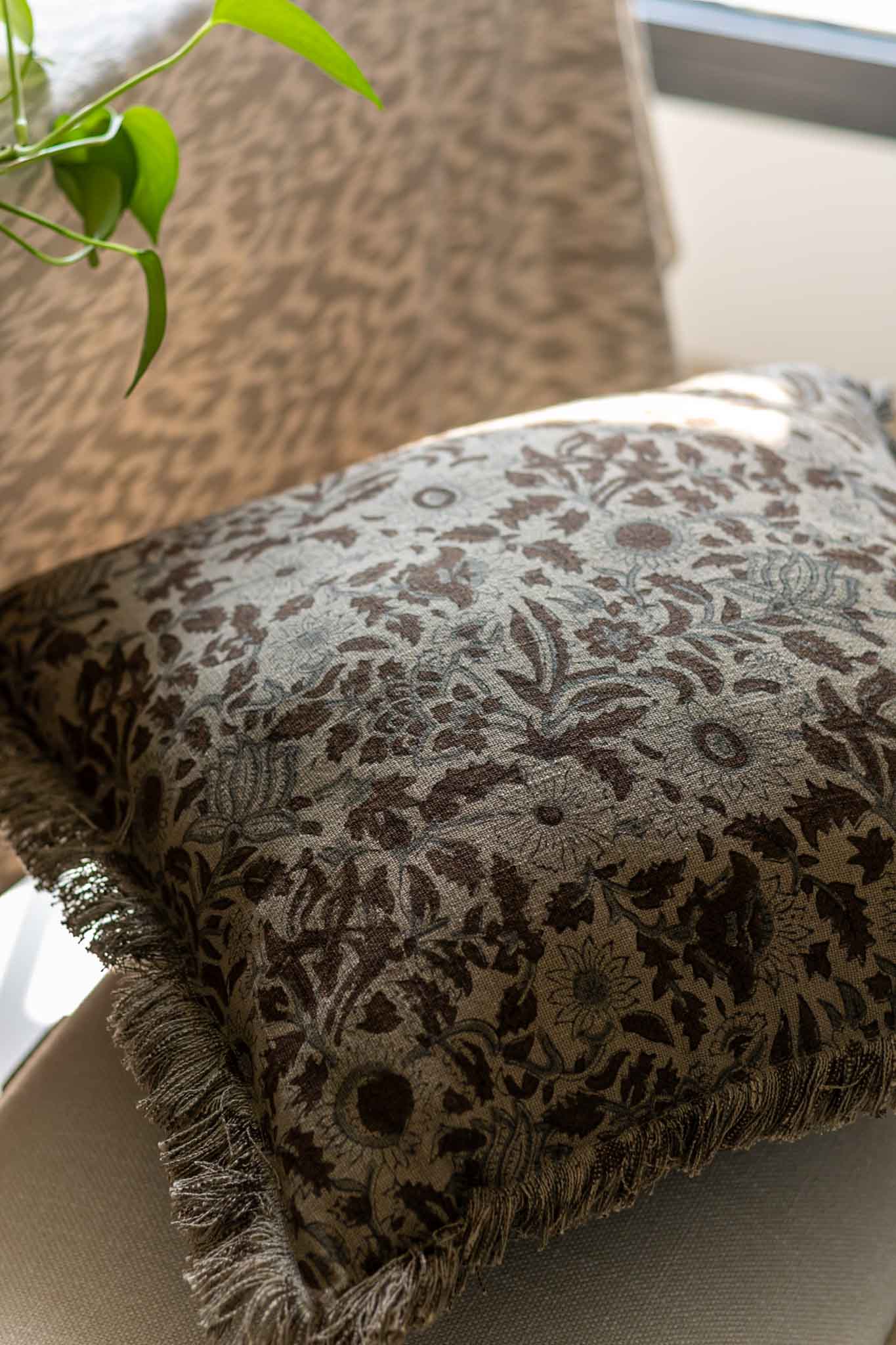 Decorative block print pillow in olive green floral pattern 