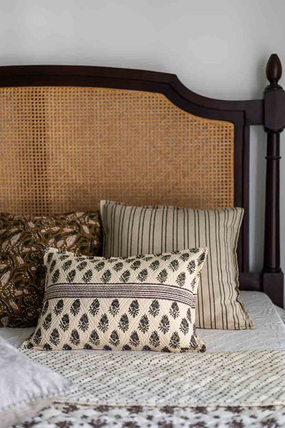 Set of Block Print Cushion covers on a Bed with Rattan frame