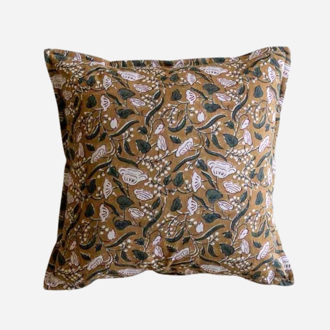 A square decorative cushion featuring an intricate botanical and bird pattern in brown and dark green on a light background.