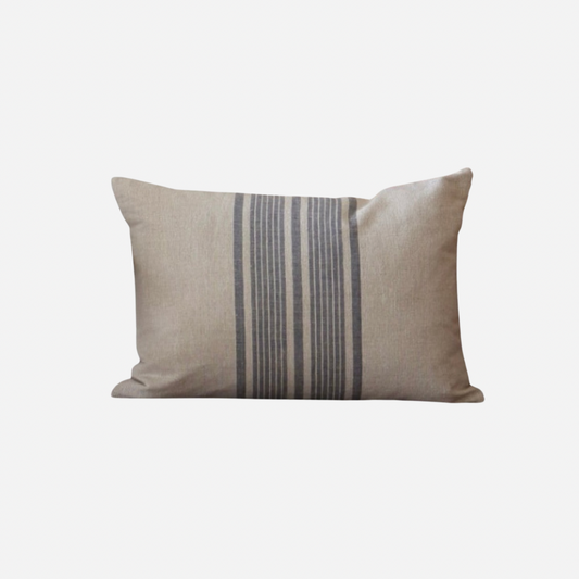 Beige linen cushion with a striped blue pattern on a white background