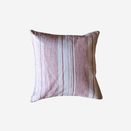 A square throw pillow with a vertical striped pattern in dusty pink, beige, and white, shown against a plain light gray background.