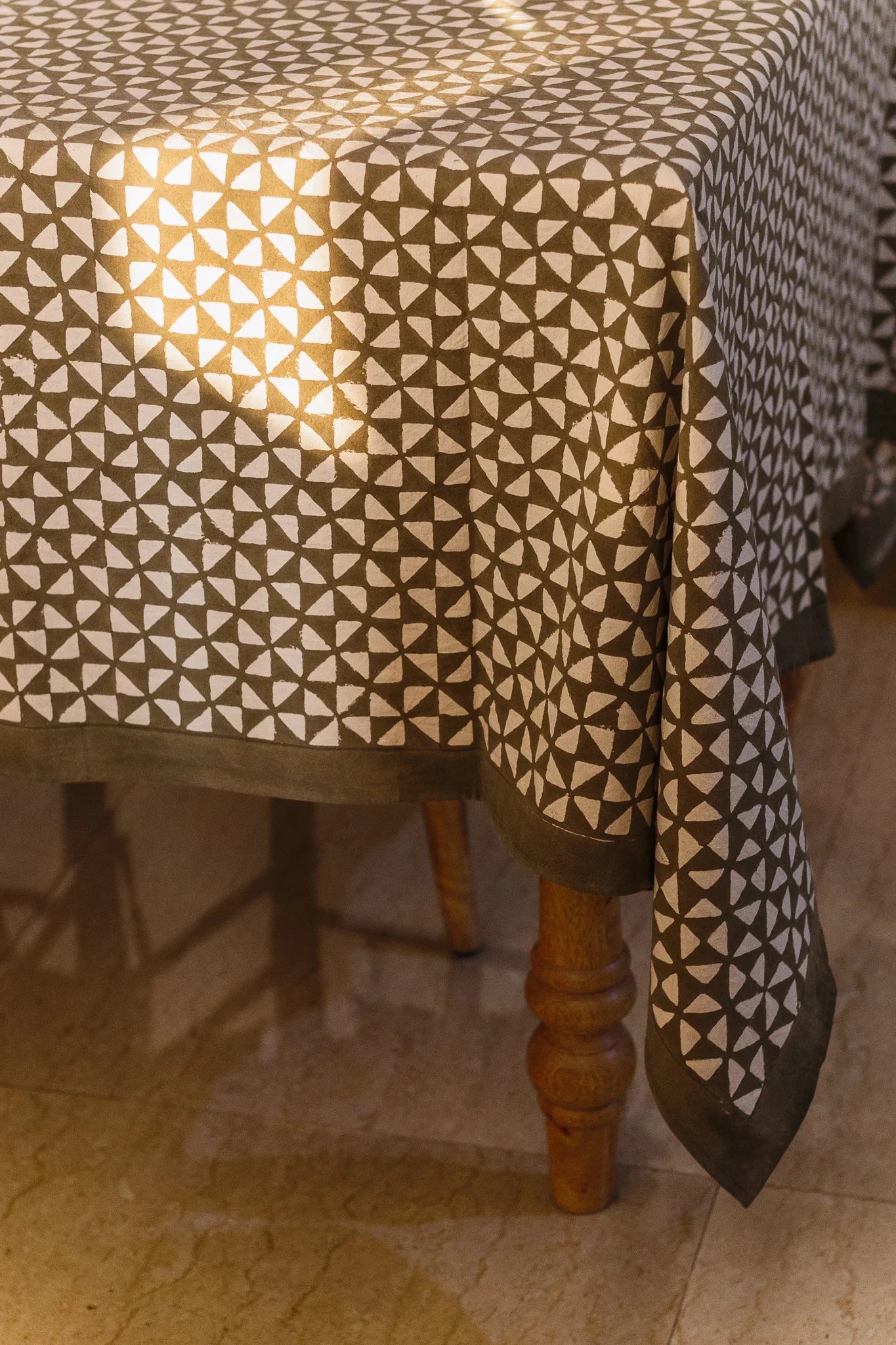 Tablecloth with geometric pattern on a wooden table