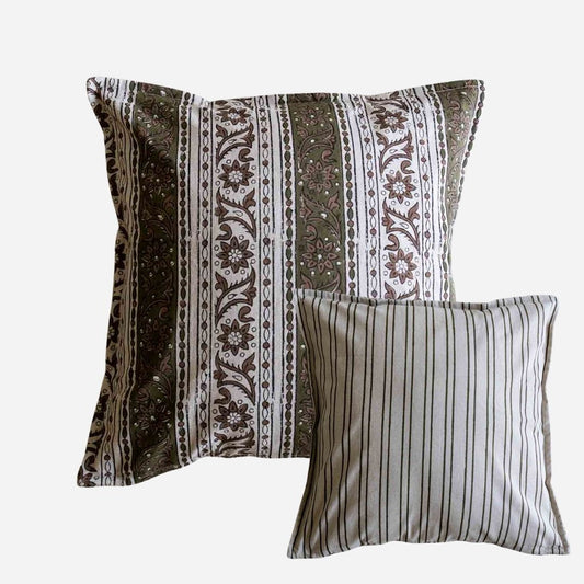 Two cotton block print cushion covers on a plain background, featuring vertical stripes with an intricate floral and paisley pattern in brown, beige, and white.