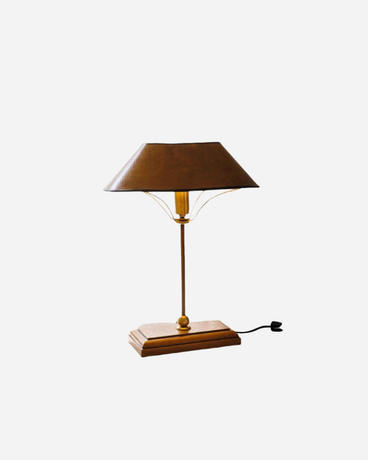Table lamp with brown shade and wooden base on a white background