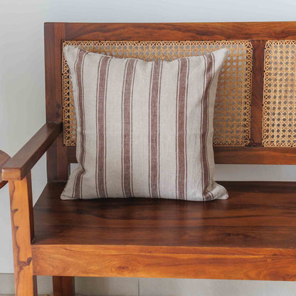 Brown Stripes Linen cushion cover on a rattan bench