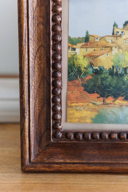 Chunky wooden photo frame showing beaded inner edge and natural wood grain