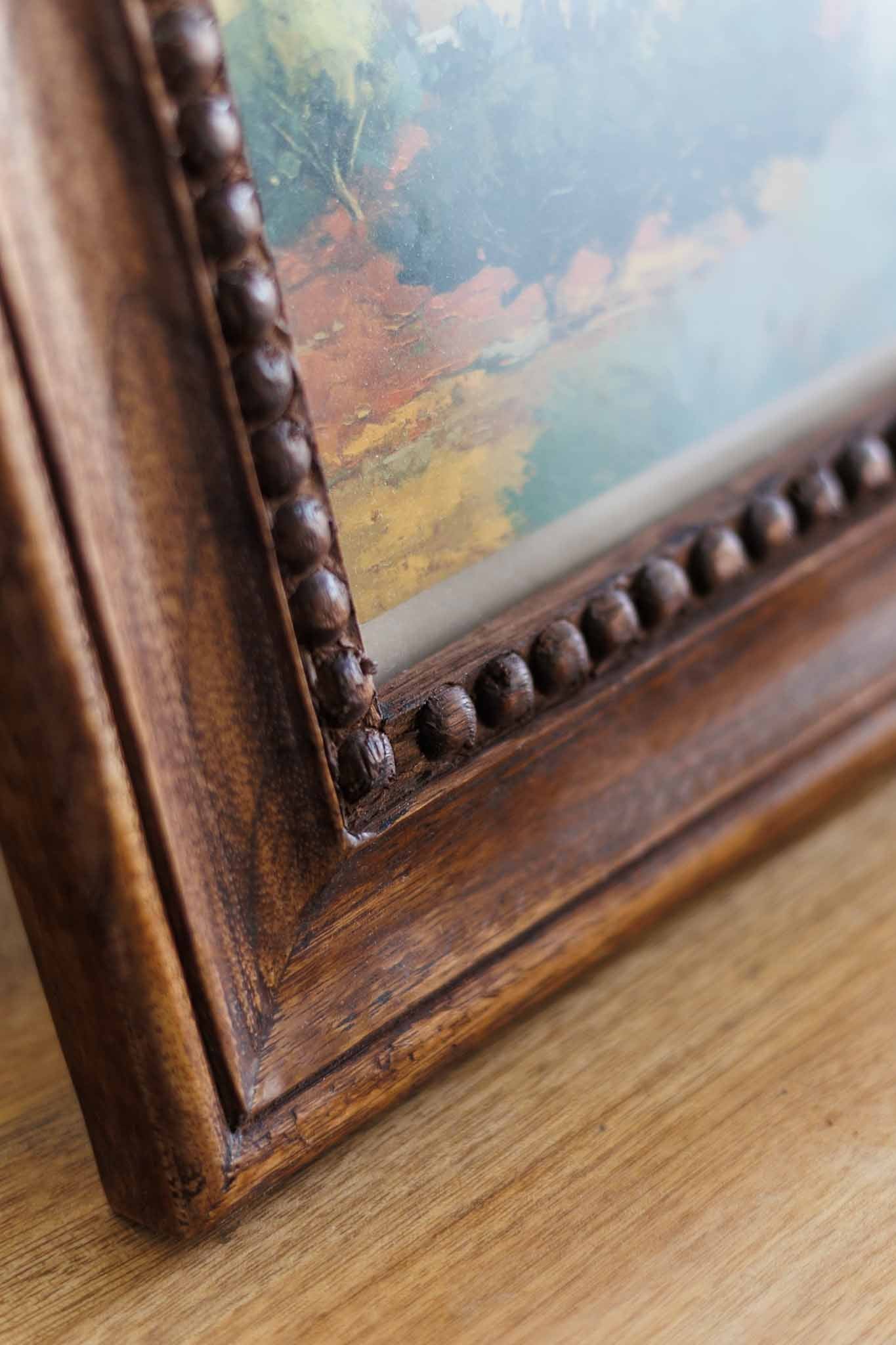 Vintage chunky wooden photo frame styled in a country living interior