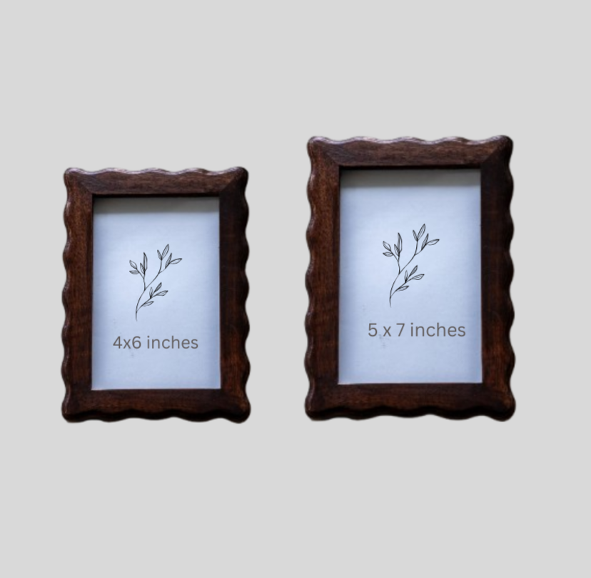 Two wooden picture frames with size labels on a light gray background